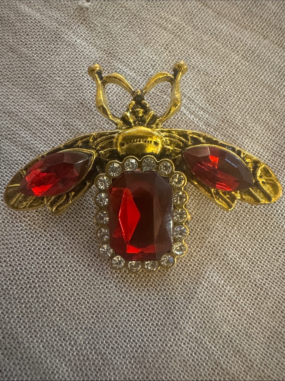 NWOT Aratta Silent Journey Gold-Tone Bee Brooch with Red Crystal Accents